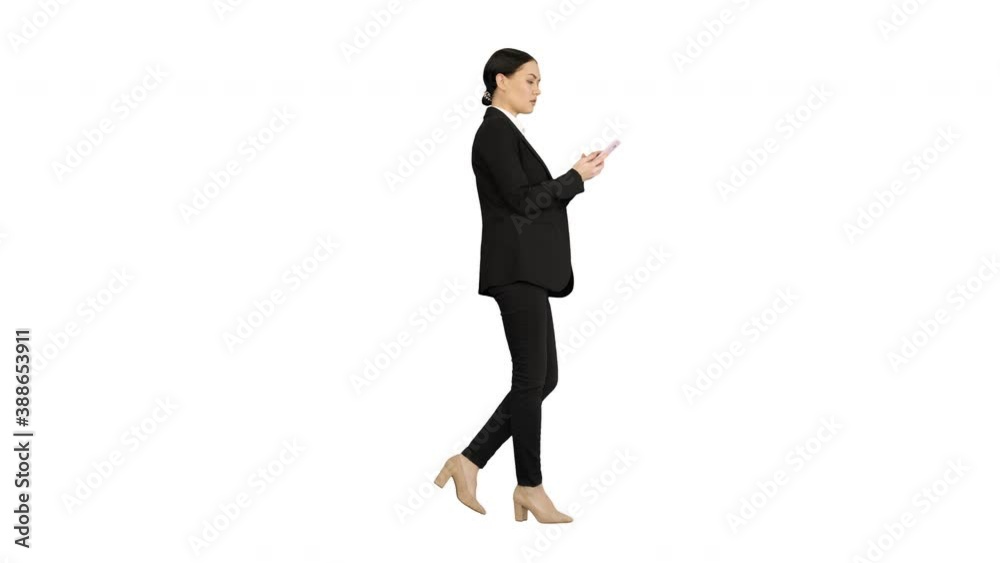 Disapprovingly looking business woman using her phone on white background. Disapprovingly looking business woman using her phone on white background.