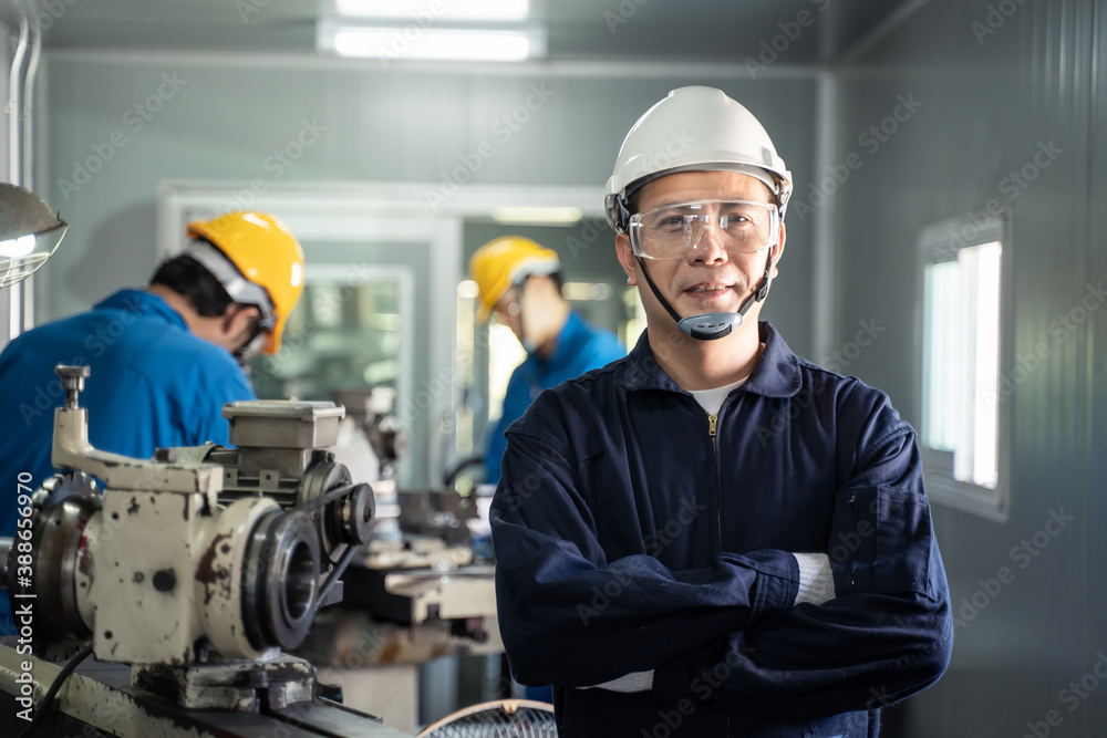 Portrait of engineer man crossing arms and looking at the camera. Portrait of engineer man crossing arms and looking at the camera.