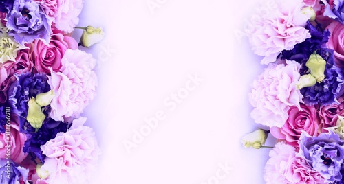 Festive floral arrangement in bright colors. Purple, pink and red flowers on a white background. Roses, peonies and ectromelia in an elegant bouquet on a white background. Background for greetings photo