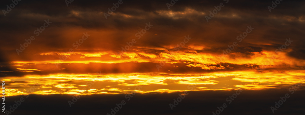 Panorama view of dramatic clouds rising of sun floating in sky to change summer weather. Soft focus, motion blur sky amazing meteorology cloud scape photography.