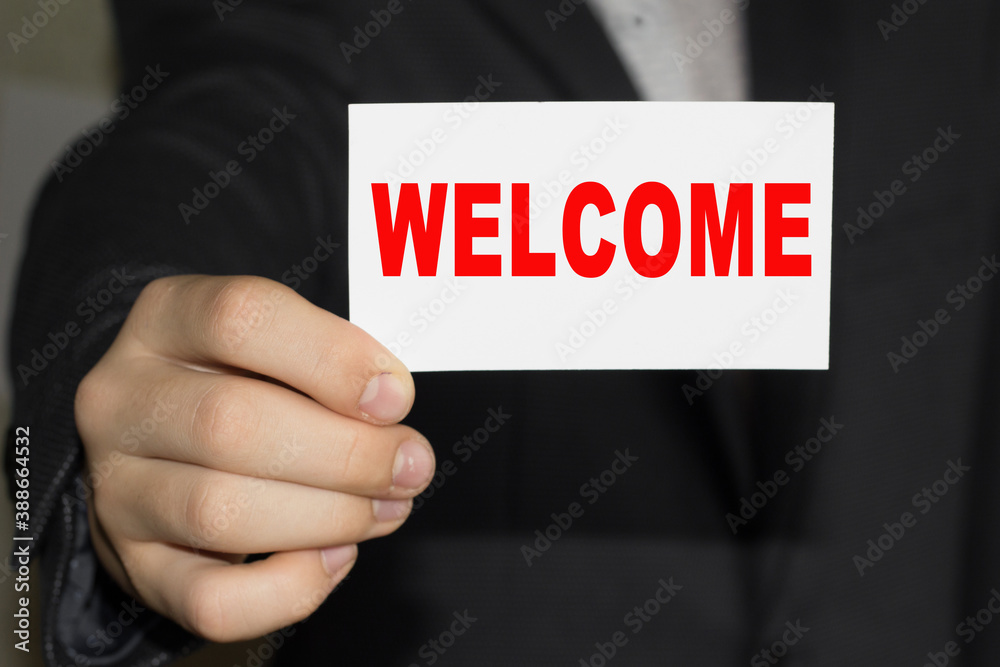 Card with text WELCOM on hand. You can use in business, marketing and other concepts. Card with text WELCOM on hand. You can use in business, marketing and other concepts.