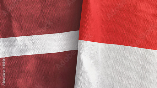 Indonesia and Latvia two flags textile cloth 3D rendering