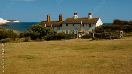 Stunning scenery at Cuckmere Haven, Sussex, England, with the Coastguard Cottages and the famous chalk cliffs, the Seven Sisters photo