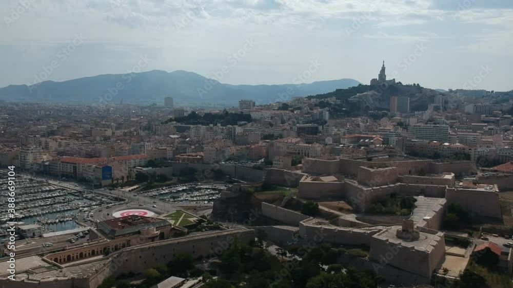 Aerial view of Marseille, France - Marseille Cathedral - Notre-Dame de la Garde and Fort Saint-Nicolas on a beautiful summer day Aerial view of Marseille, France - Marseille Cathedral - Notre-Dame de la Garde and Fort Saint-Nicolas on a beautiful summer day