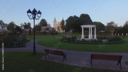 White Rotunda and St. Archangel Michael Church in Sirvintos in the Evening. Aerial Low Dolly In Footage. photo