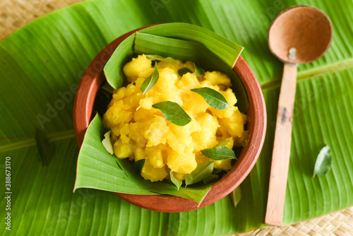 Cooked tapioca or Cassava root , Mandioca or Aipim, Kerala special Kappa Puzhukku or Kappa biryani South Indian food with spicy meat curry, beef tapioca, India. with Fish curry. root vegetable Brazil photo