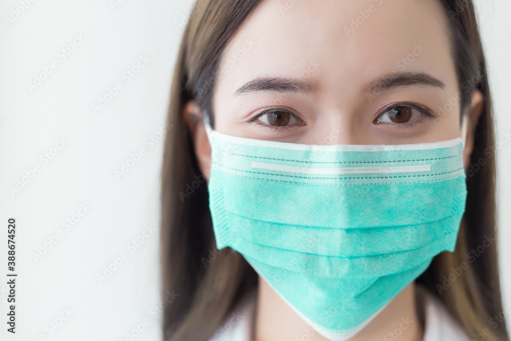 Asian beautiful woman wear a face mask to protect coronavirus. Asian beautiful woman wear a face mask to protect coronavirus.
