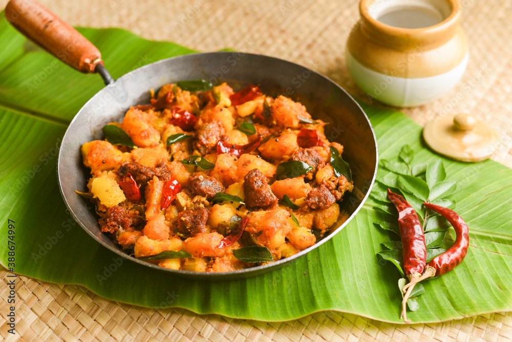 Kappa Biryani Cooked tapioca and spicy meat curry , Cassava root , Mandioca  or Aipim, Kerala special Kappa Puzhukku South Indian food beef tapioca,  India. with Fish curry. root vegetable Brazil Stock