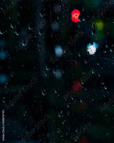 rain drops on the window with bokeh refelctions
