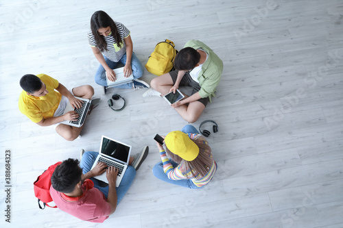 Students with modern device...