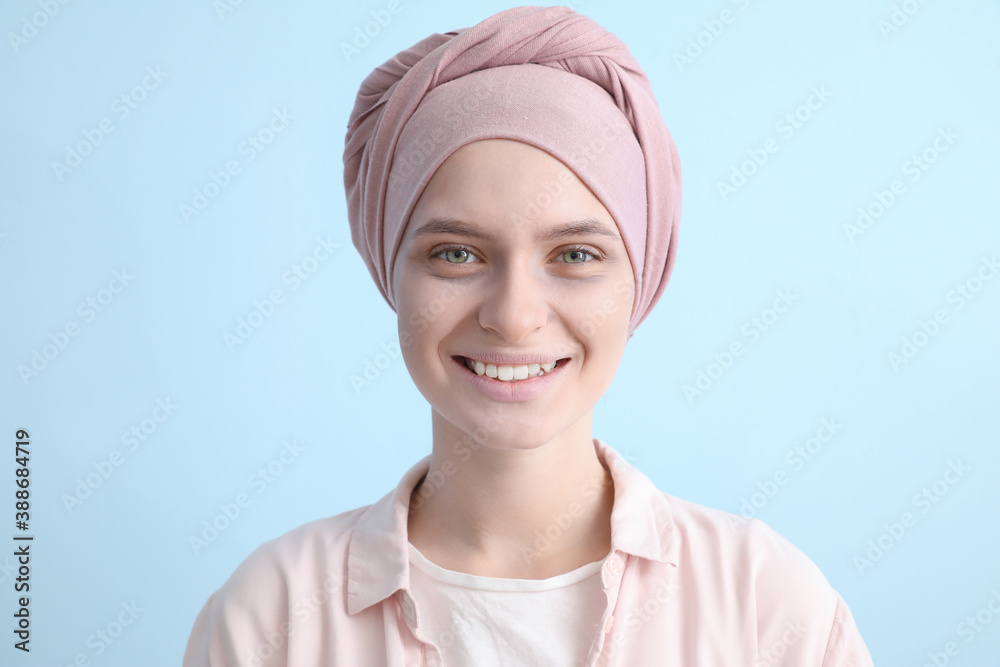 Optimistic woman after chemotherapy on color background Optimistic woman after chemotherapy on color background