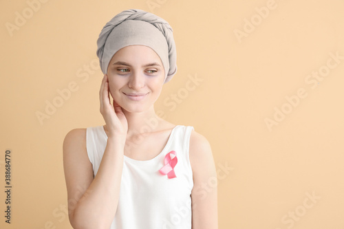 Wallpaper Mural Woman after chemotherapy with pink ribbon on color background. Breast cancer awareness Torontodigital.ca