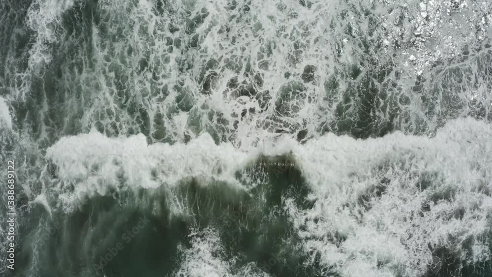 Close up drone shot of blue waves crashing Close up drone shot of blue waves crashing