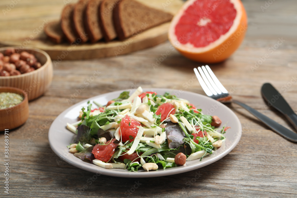 Delicious carrot salad served on wooden table Delicious carrot salad served on wooden table