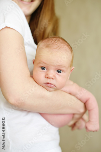newborn baby on mothers hands
