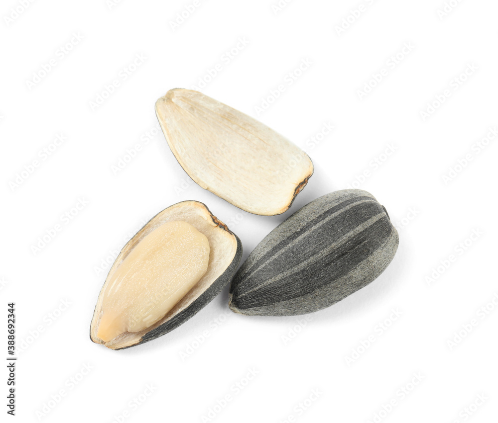 Raw peeled sunflower seed and shell isolated on white Raw peeled sunflower seed and shell isolated on white