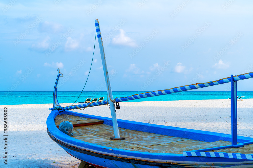 View of nice tropical beach with old boat View of nice tropical beach with old boat