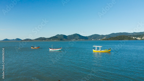 Fisherman boat on the coast, aerial image from Florianópolis, Santa Catarina Brazil