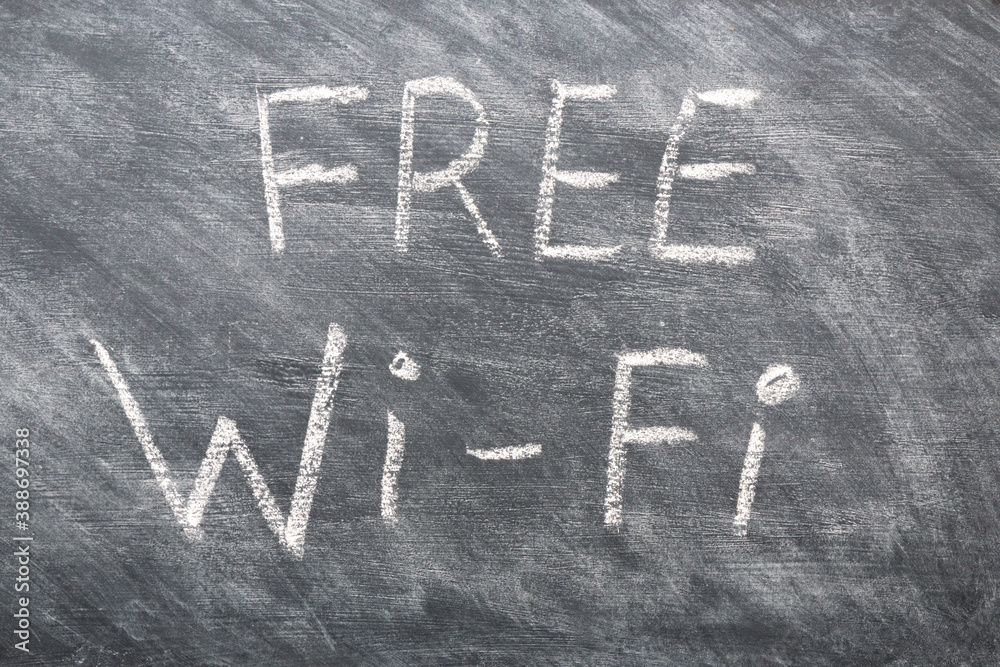 Fototapeta premium chalk inscription free wi-fi on black chalkboard