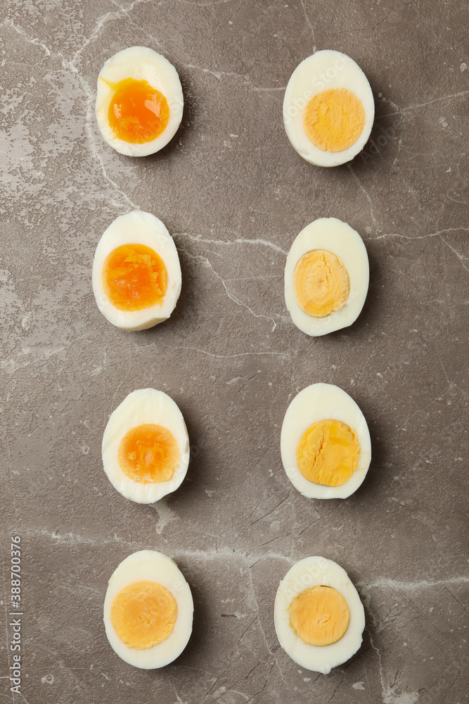 Flat lay with boiled eggs on gray background, top view Flat lay with boiled eggs on gray background, top view