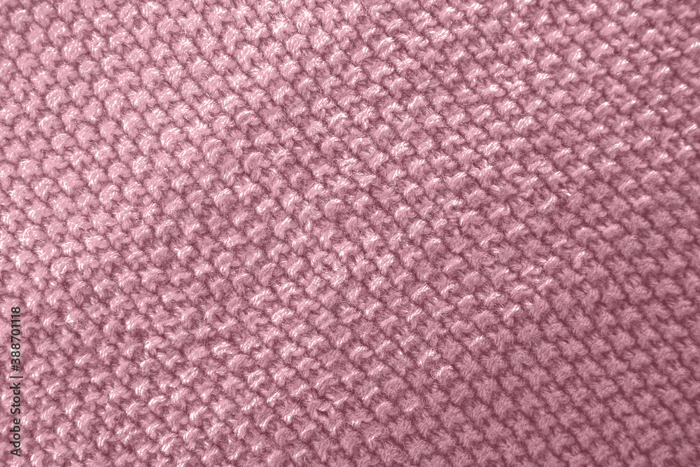 Fototapeta premium Knitted texture in pink color. Close up.