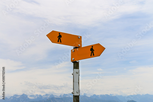 Pedestrian sign both sides with cloudy background
