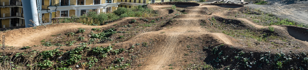Ground pump track for downhill mountain bike riding in bikepark Ground pump track for downhill mountain bike riding in bikepark