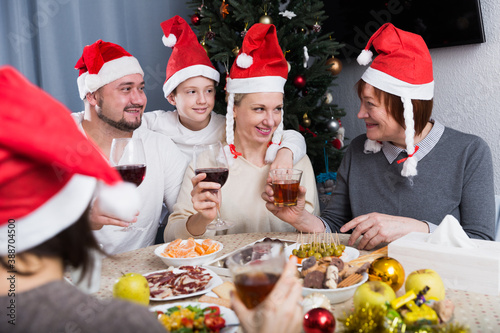 Big happy family celebrating Christmas, enjoying dinner at home