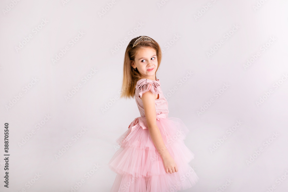 Beautiful little princess dancing in luxury pink dress Beautiful little princess dancing in luxury pink dress
