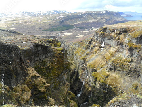 Hiking in the wild and dramatic landscape of Iceland's fjords, glaciers, mountains, volcanoes and waterfalls