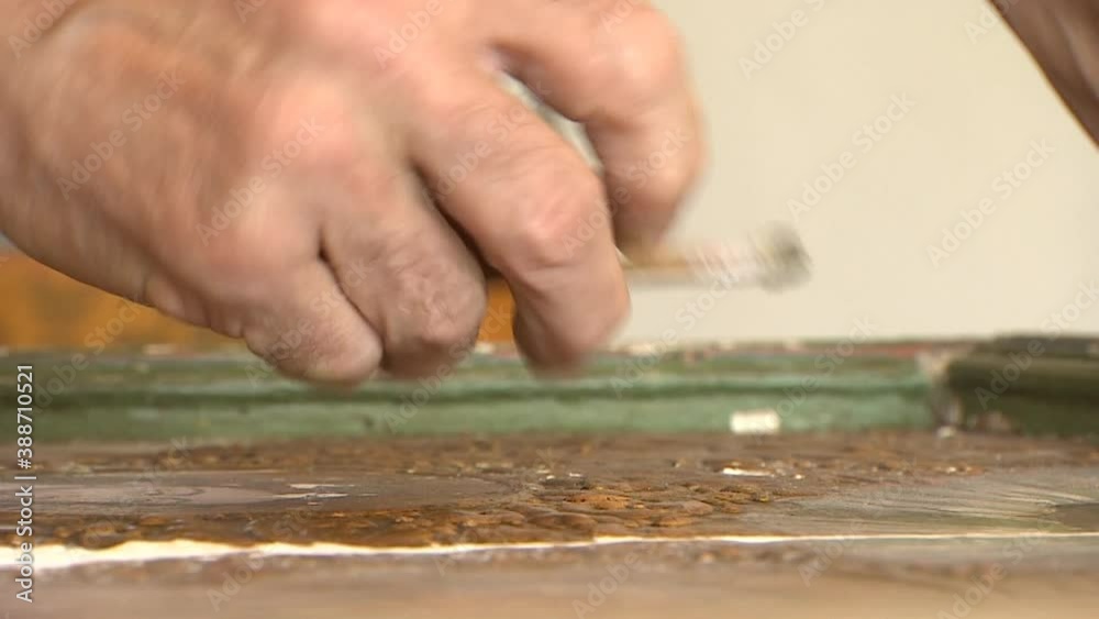 Manual restoration to restore an old valuable painting. Handmade.