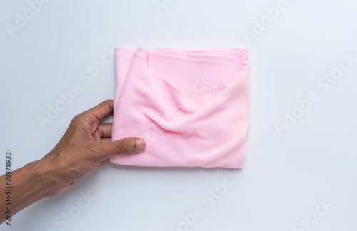 Pink microfiber cloth on white background.