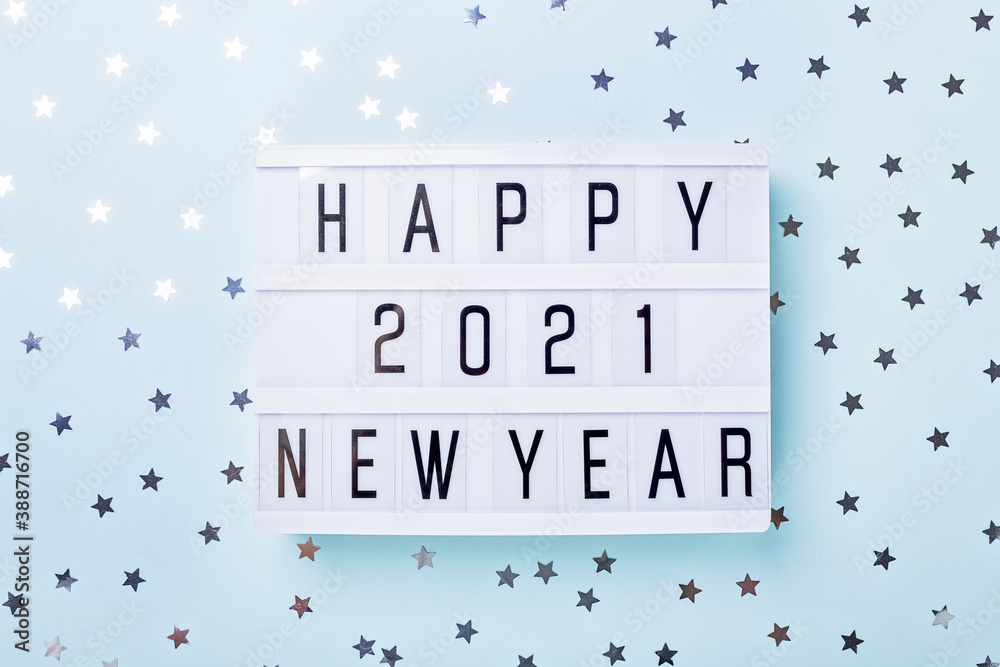 Lightbox with text HAPPY NEW YEAR 2021 on blue background. Top view. New year celebration. Happy New Year 2021 concepts - obrazy, fototapety, plakaty 
