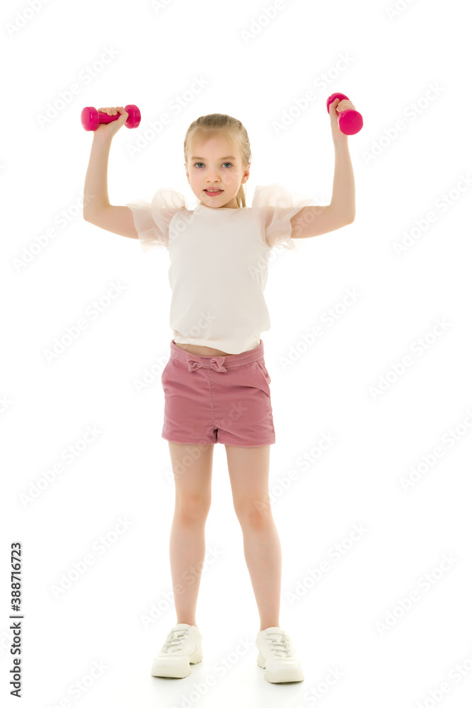Little girl doing exercises with dumbbells. Little girl doing exercises with dumbbells.