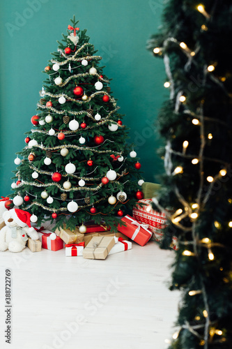 New Year's Home Christmas Tree with gifts decor green background