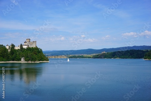 Lake Czorsztyn and medieval castle in Niedzica. The beauty of nature and architecture in Southern Poland. Medieval Castle in Niedzica, built in 14th century and artificial Czorsztyn Lake © Piotrek J.