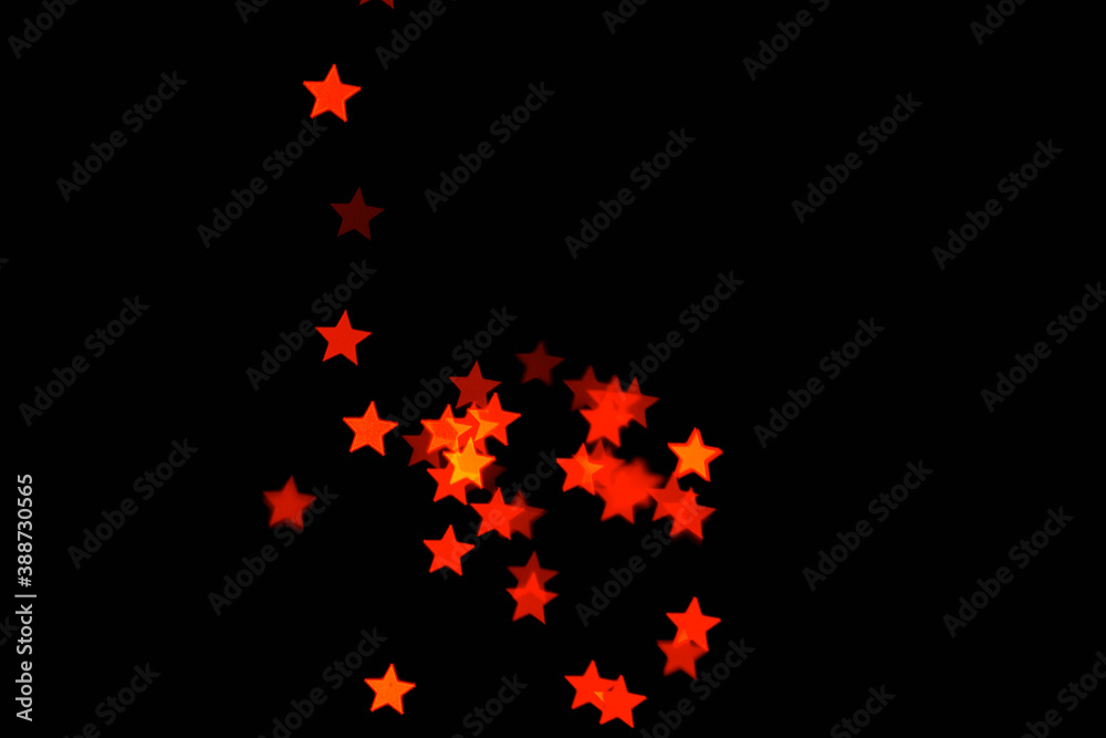 light orange star light effect isolated overlay glitter texture on black.