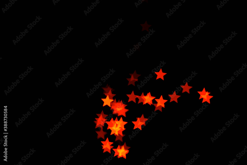 light orange star light effect isolated overlay glitter texture on black.