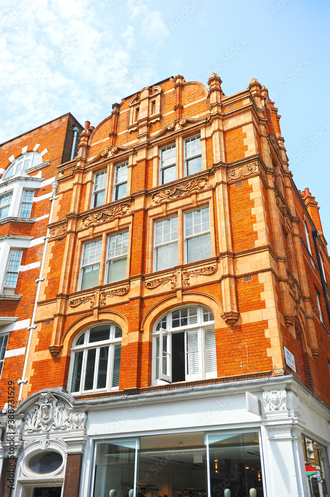 Fototapeta premium London, UK. Red brick buildings in Long Acre Street at City of Westminster. 