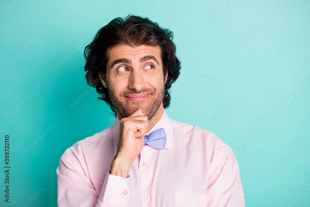 Photo of handsome smiling brunet guy wear formal cloth looking empty space isolated on teal background
