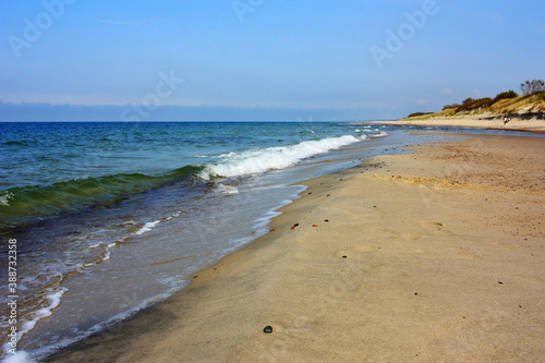 Sandy shore of the calm Baltic Sea