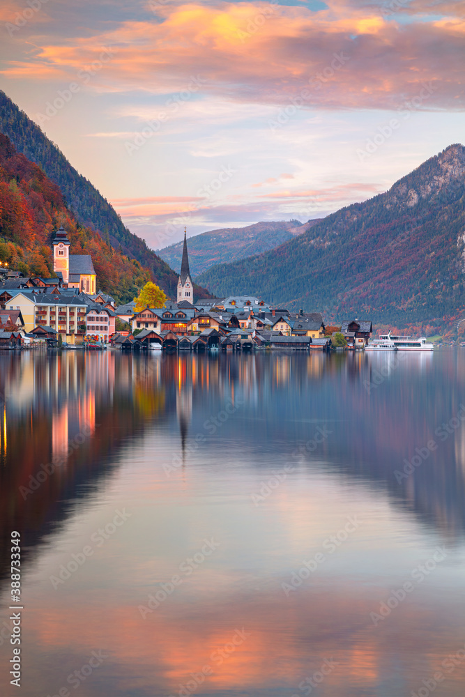 Hallstatt, Austria. Cityscape image of iconic alpine village Hallstatt at dramatic autumn sunset.