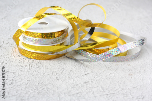 Gold and silver ribbon with halogram for decoration. Selective focus. photo