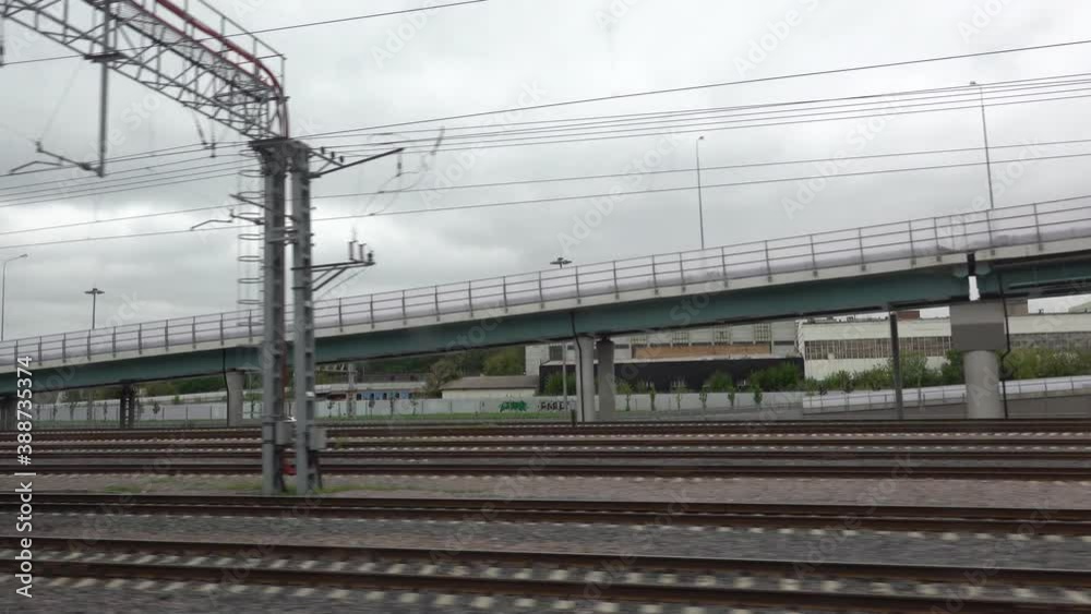 View of the railway rails and sleepers running outside the train window. View of the railway rails and sleepers running outside the train window.