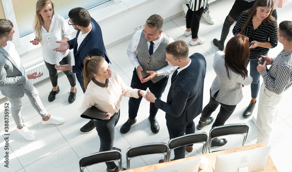 top view. a group of employees discussing work issues top view. a group of employees discussing work issues