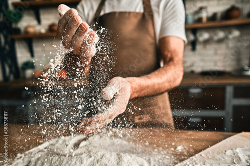 Close up of male hands with flour splash