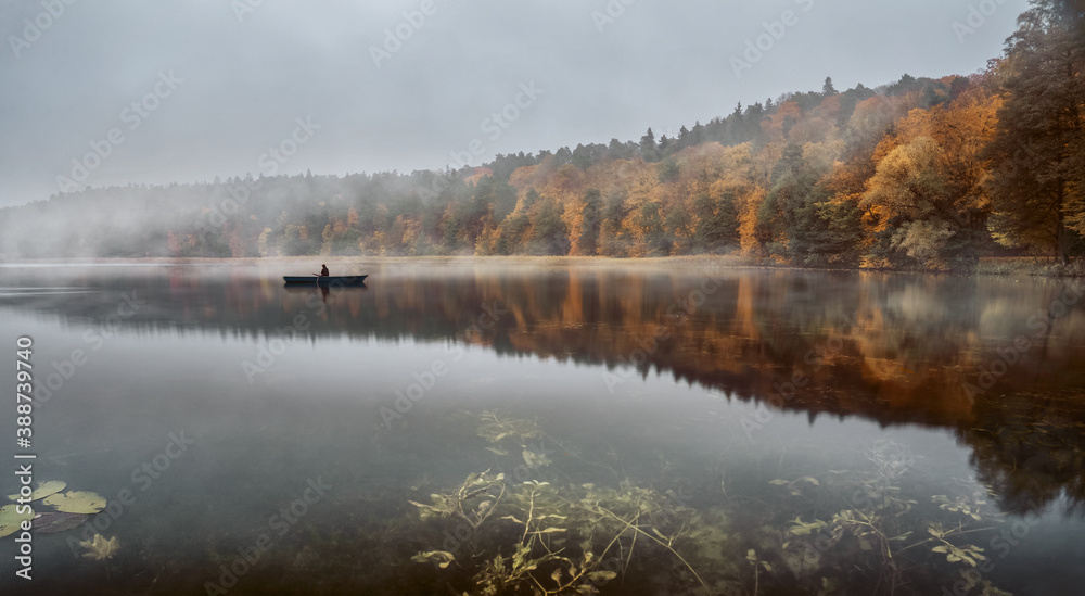 Calm autumn morning over the lake with copy space