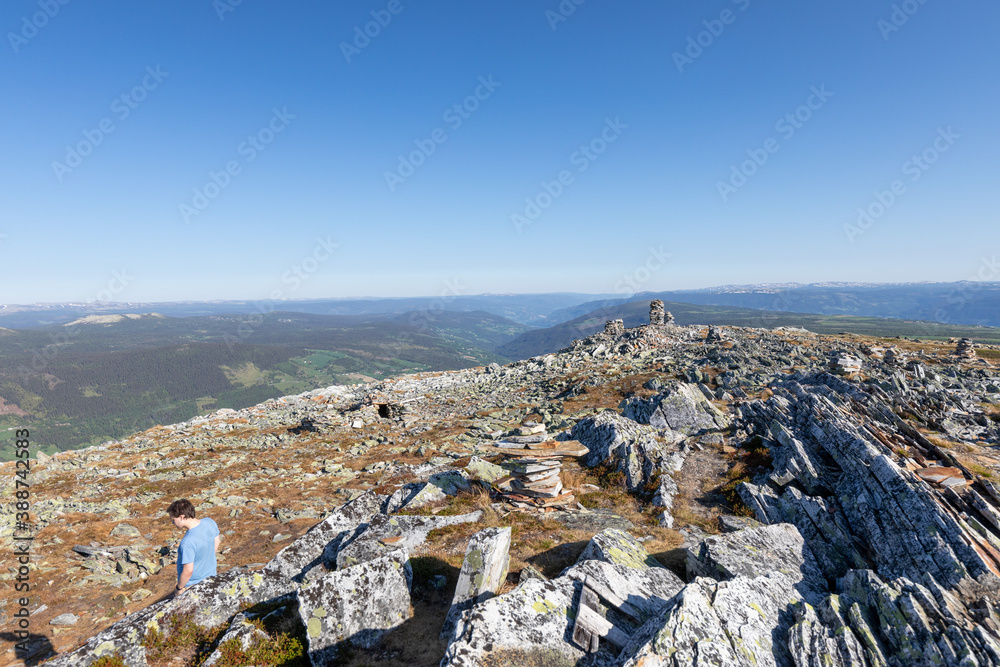 hiker on the top of mountain in norway