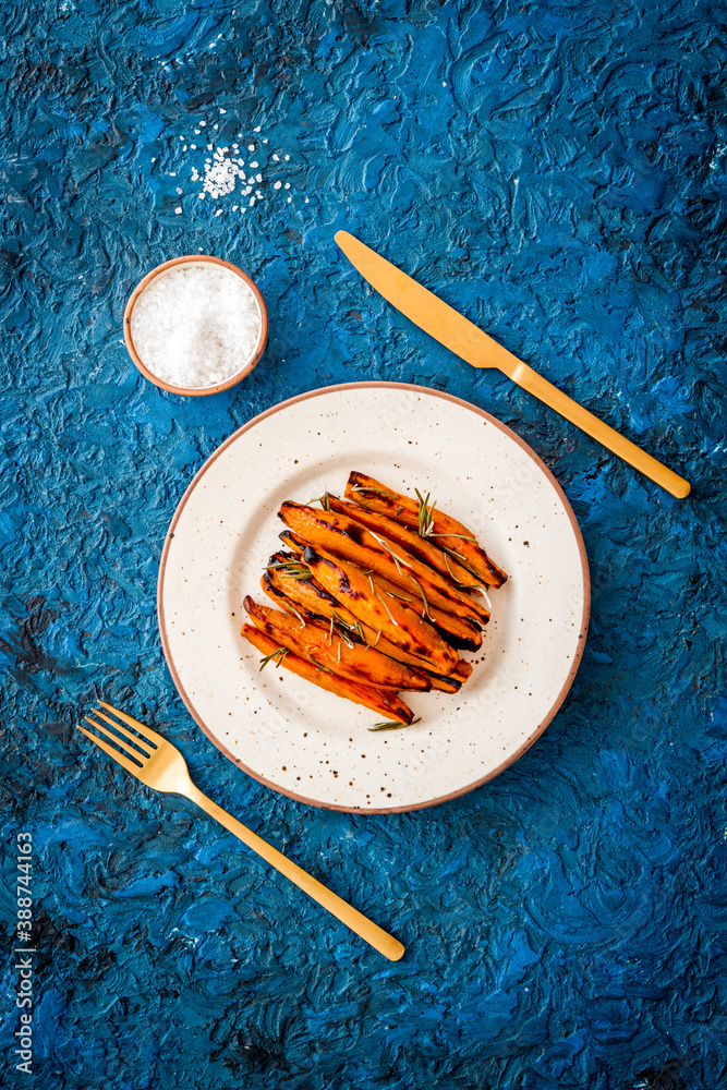 Top view of sweet potato fries with herbs and spices Top view of sweet potato fries with herbs and spices
