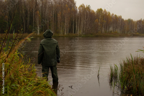 fisherman near the autumn lake